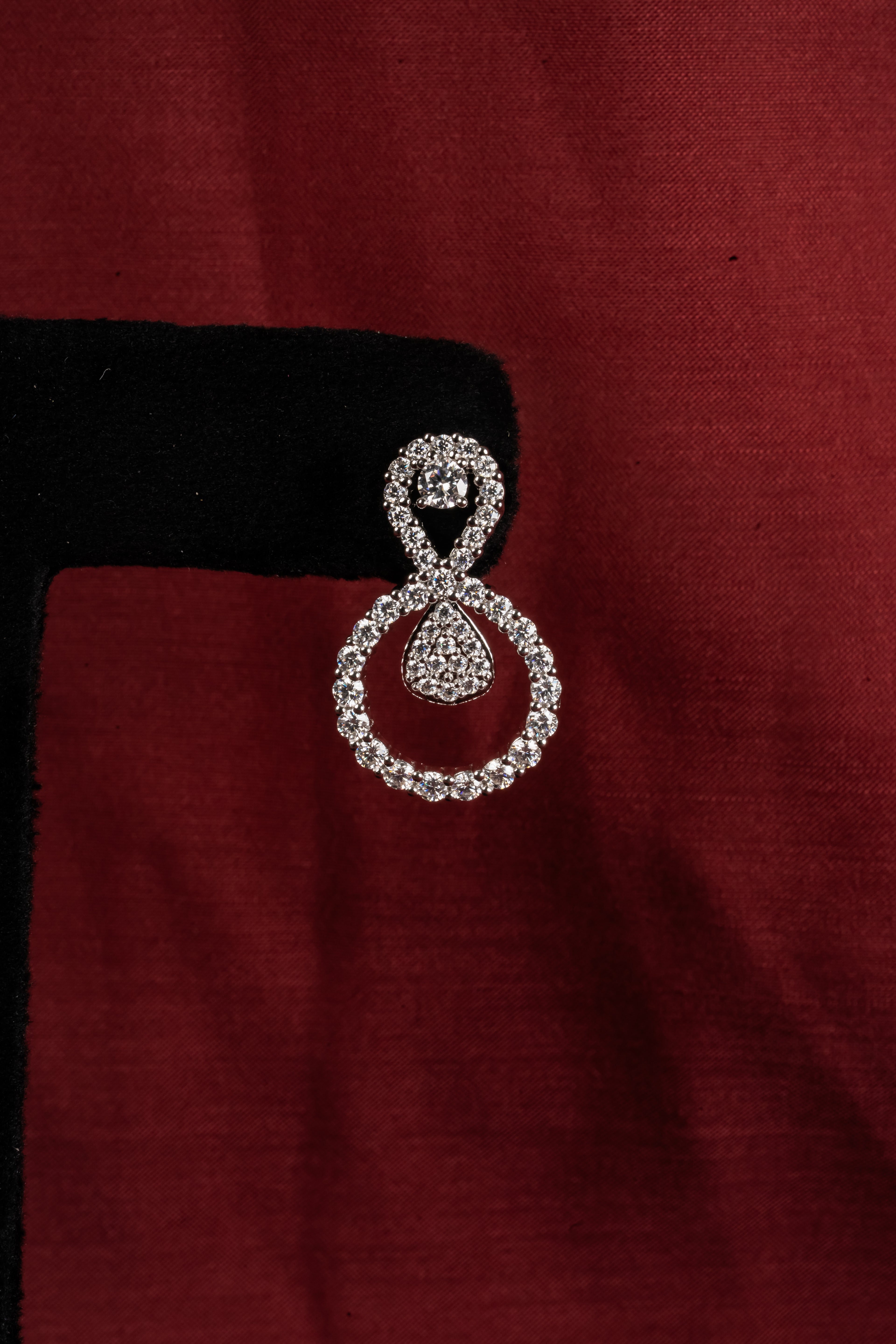 Silver Infinity Drop Earrings – Detail View – Silver Moissanite – Myraé